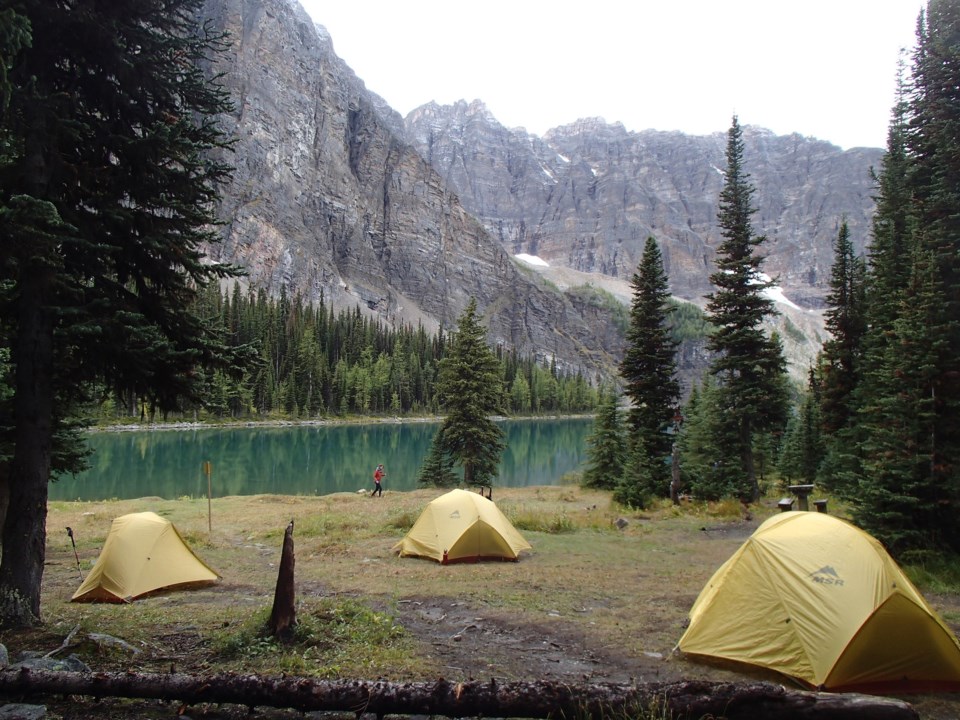 GetOutside-WomensIntroBackpacking-tents-mountains-lake-trees