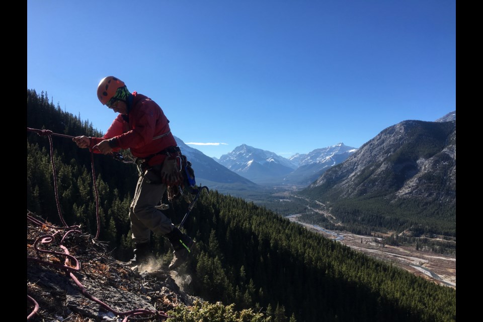 Grant Parkin preparing to rap down what become known as "Slabby McSlabface" a popular multipitch in Kananaskis bolted by him and Ian Greant.