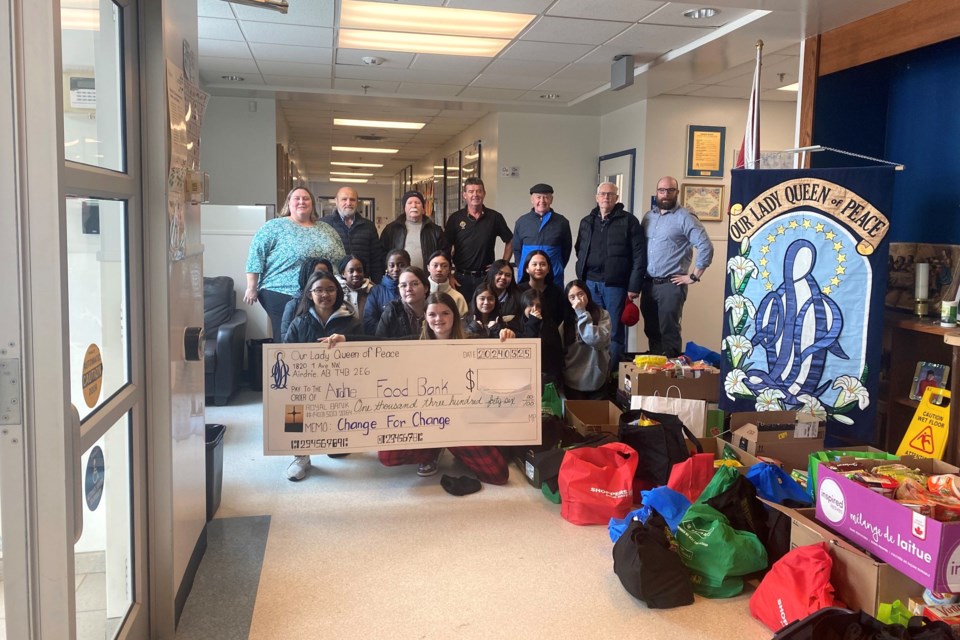 The leadership students at Our Lady Queen of Peace School took on a big role helping to prepare and carry all the donation. Also pictured are the Knights of Columbus volunteers, the Assistant Principal and Principal Michelle Davies.