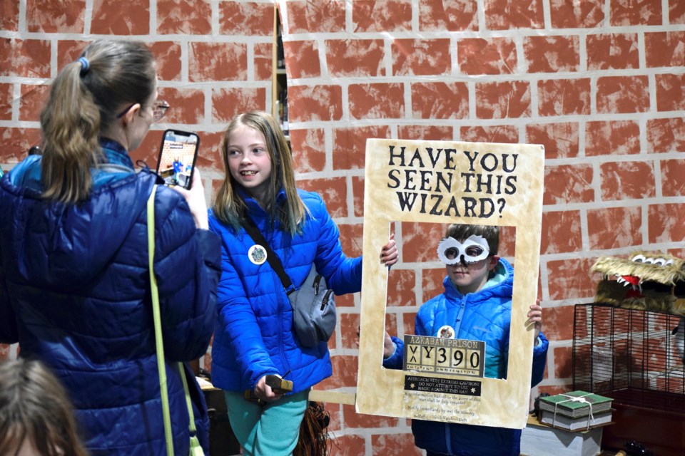 Young witches and wizards descended on the Airdrie Public Library on April 6 for a days long celebration of Harry Potter day. The library organized numerous Harry Potter themed activities, like a Platform 9 3/4 photo booth, a sorting hat station, and a place for witches and wizards to duel. 