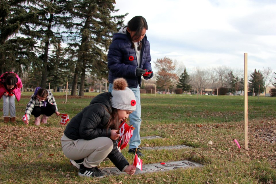 Students from St. Veronica School in Airdrie and St. Gabriel School in Chestermere took part in the No Stone Left Alone ceremony on Nov. 6, honouring veterans laid to rest at the Garden of Peace Cemetery.