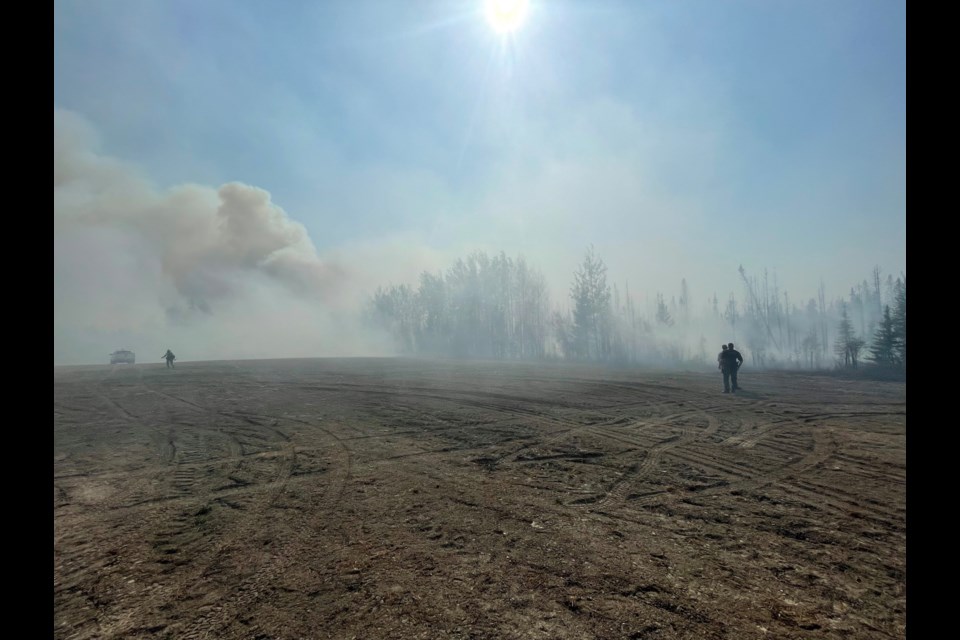 Smokey ground in the middle of the northern Alberta wildfire zone.
