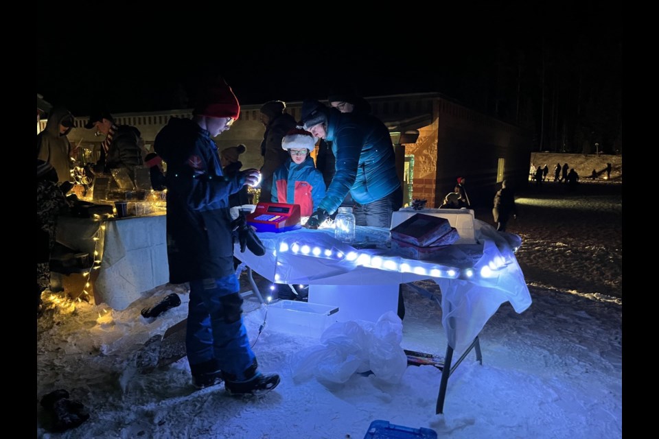 While younger students host a concert outside of the school, students in grades five to eight sell products at their market.