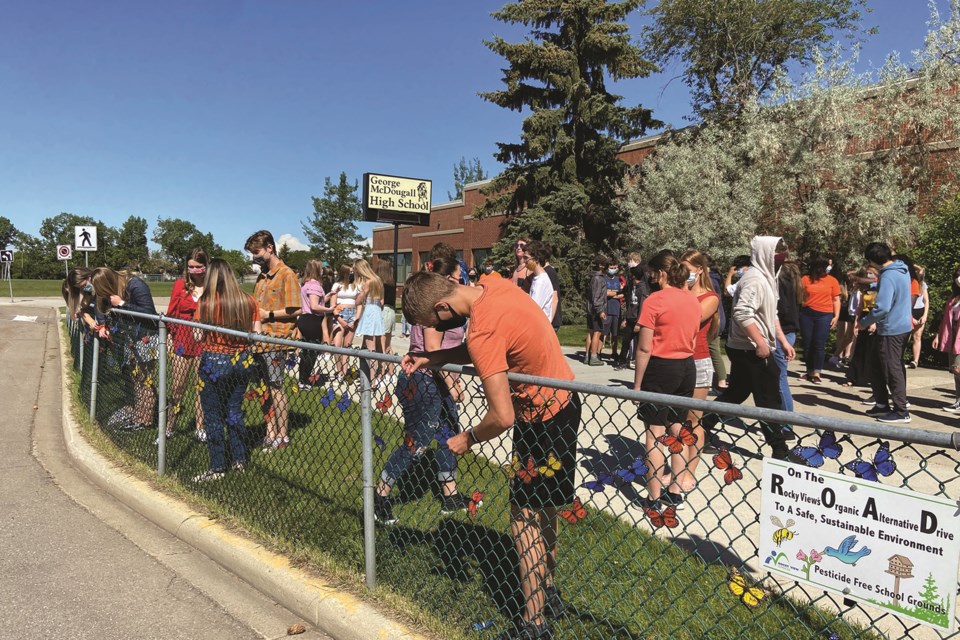 George McDougall High School students recently posted butterflies on the school's surrounding fences with inspiring messages to honour the remains of residential school students found in B.C. and Manitoba in recent weeks. Photo submitted/For Airdrie City View