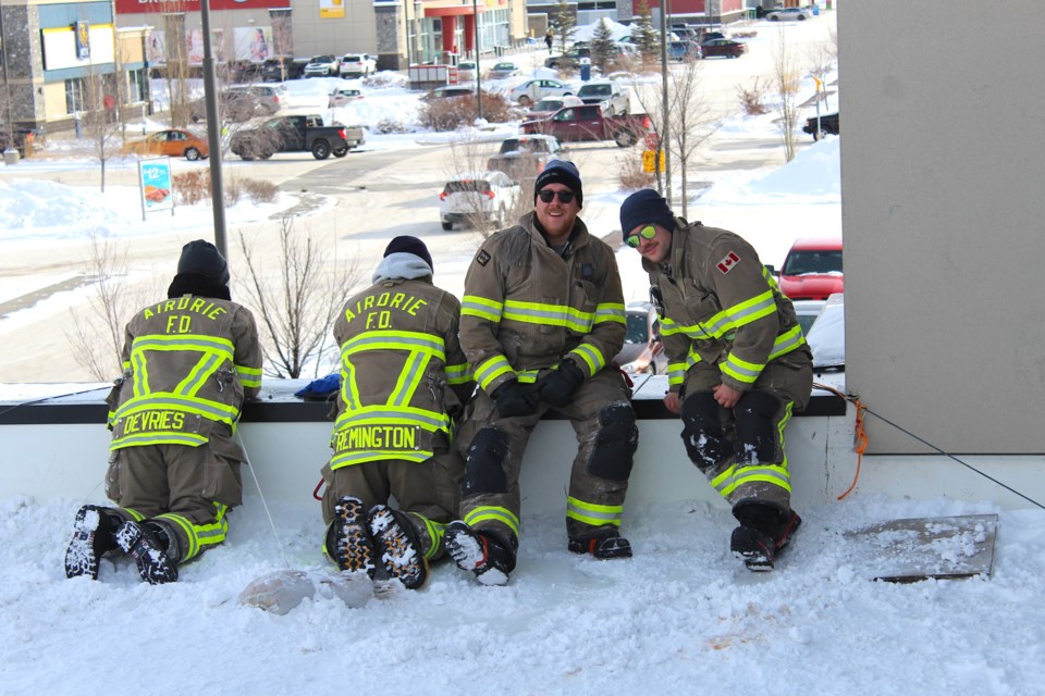 Airdrie Firefighters Rickey-Lee Devries, Joel Veitch, Alex Moran and Trevor Remington were grateful their long, cold ordeal concluded at 11 a.m. on Saturday. The four had spent a bitter 72 hours on the rooftop of the Toad n Turtle Pub to raise awareness and funds for Muscular Dystrophy Canada. The quartet were given a hero’s welcome as they descended from the roof one last time.
