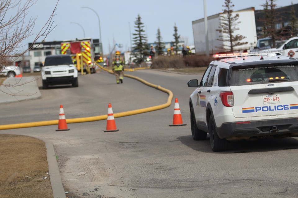 Airdrie firefighters, police and other emergency officials were on the scene of a compactor fire behind the Canadian Tire store on Veterans Blvd on Thursday. April 11.