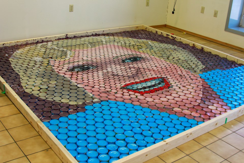 Pet portrait of Betty White made entirely out of cans of cat food at APARC in Airdrie.