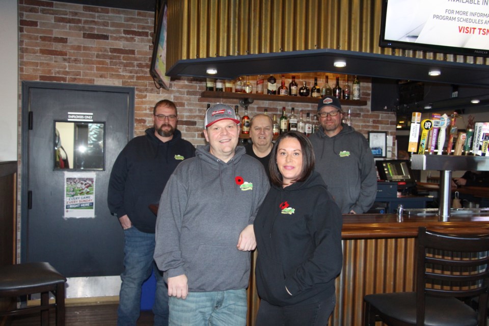 Bogey's Pub & Pizza in Airdrie recently celebrated 20 years in operation. Pictured are Duane, Dave, and Lyle Kent, and Warren and Tammy Cotton in the forefront.