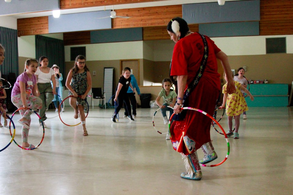 Kids during a special master class learned to hoop dance with Blackfoot elder Shirley Hill taught and Airdrie Music Lessons (AML) on April 30.