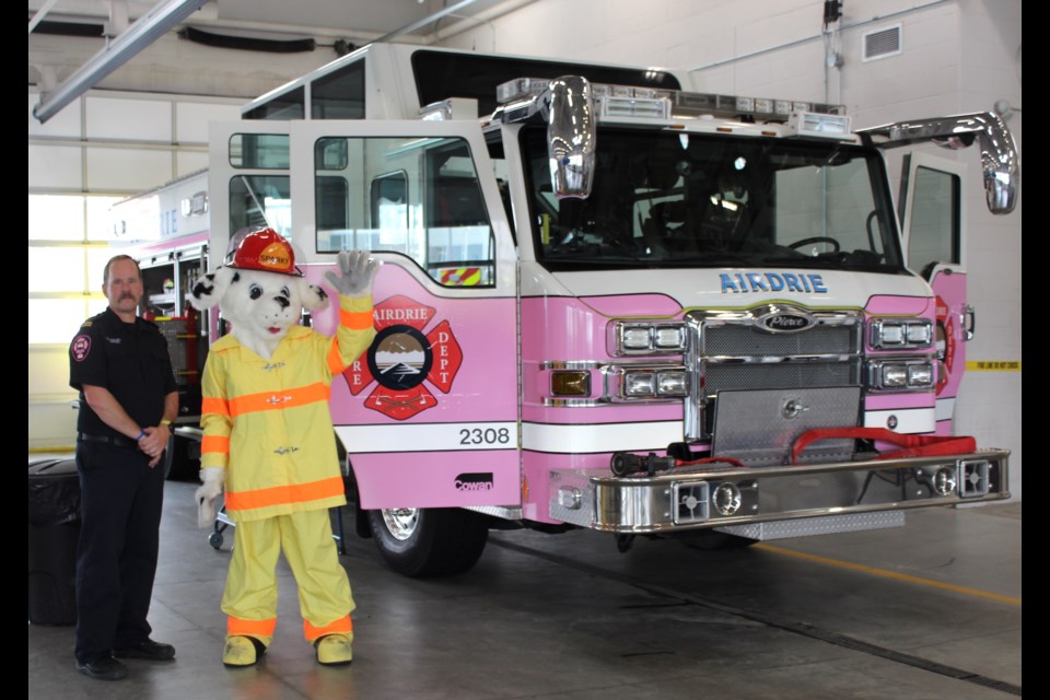 Touring the big (pink) fire truck was a popular activity with the crowds during Fire Safety Day.