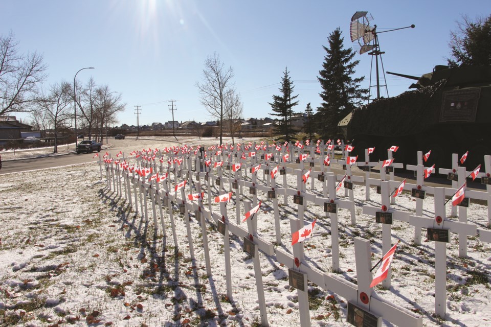 White crosses are pictured row on row in front of Nose Creek Valley Museum in honour of fallen soldiers, Oct. 30. 