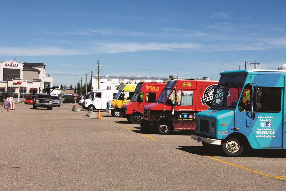 The drive-thru version of the Food Truck Frenzy took place Aug. 14-16 in the parking lot of the Ron Ebbesen Twin Arena. Photo by Jordan Stricker/Airdrie City View