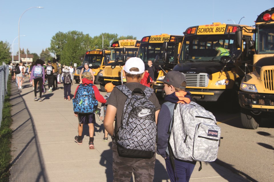 Students return for their first day of classes at the tri-school site in Airdrie on Sept. 2.