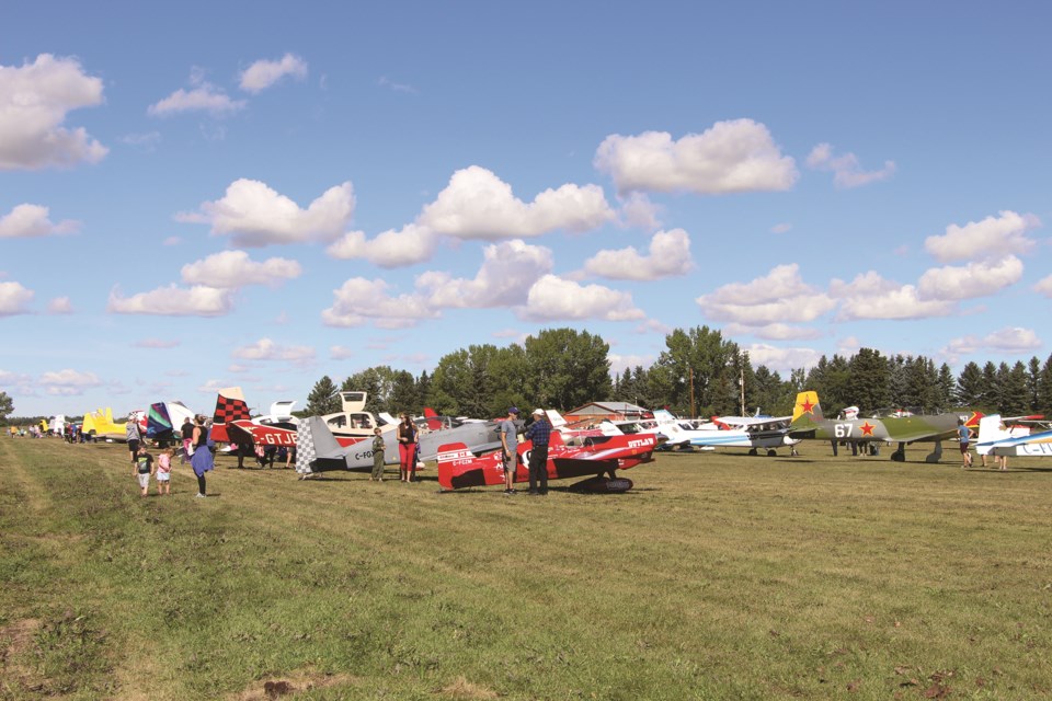 An assortment of airplanes were lined up at the 2021 Alberta Air Tour for passersby to admire on Aug. 28. Photo by Carmen Cundy/Airdrie City View