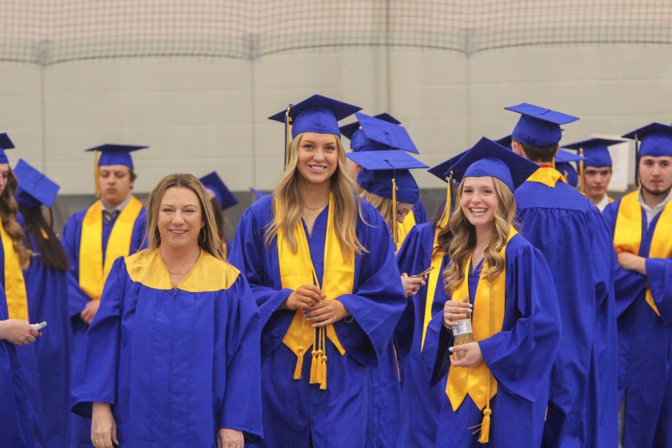 Bert Church 2022 graduates get ready to walk into the gymnasium at Genesis Place to receive their diplomas on May 28.