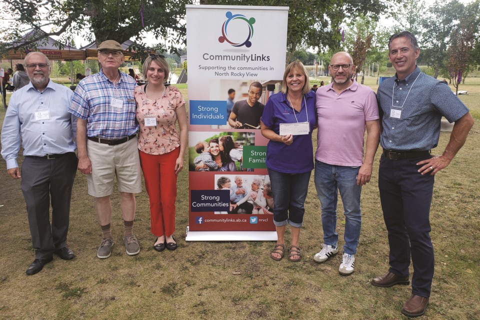 Westmark Holdings, an Airdrie-based company, made a public donation to Community Links during its 40th anniversary celebration on Aug. 26. 
Left to right: Stuart Clark, Community Links Board; Dirk Bannister, Community Links Board; Mary Rawson, Community Links Board; Brenda Hume, Executive Director; Paul Gerla, Westmark; Brett Mark, Community Links Board Chair. 