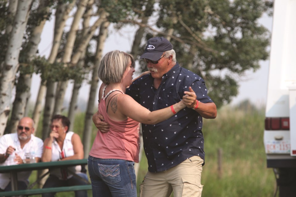 Two patrons of a previous Cars and Country Stars event dance the night away on July 24. File photo/Rocky View Weekly