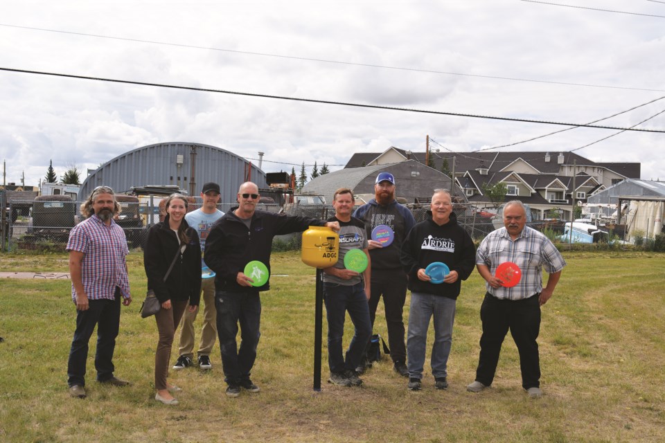 On Aug. 20, Mayor Peter Brown, Couns. Tina Petrow, Ron Chapman and Al Jones gathered with members of the Airdrie Disc Golf Club and the City of Airdrie Parks Department, to unveil a temporary nine-hole disc golf course located in Fletcher Regional Park.