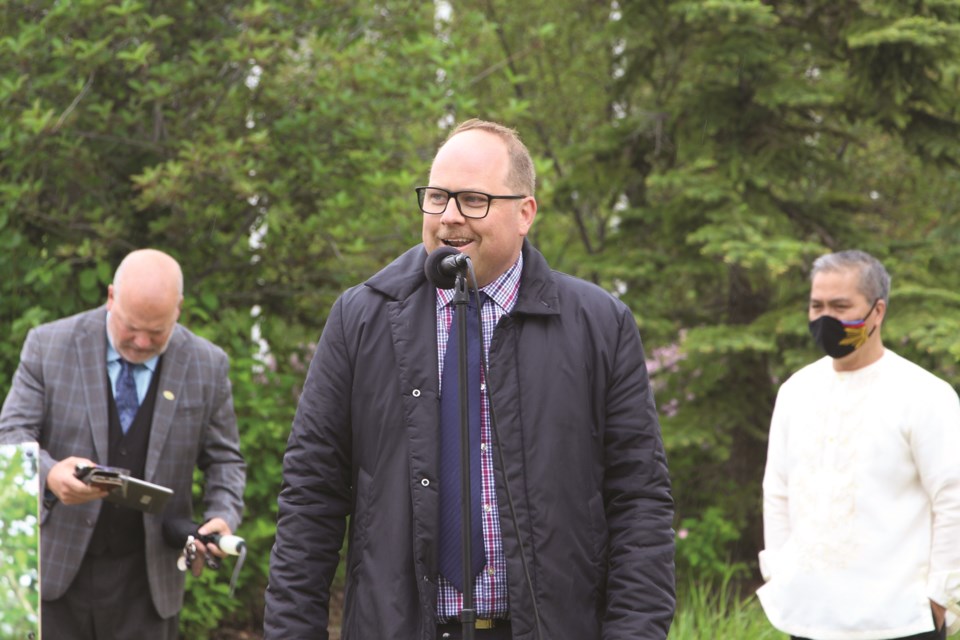 Michael McAllister, community developer of culture for The City of Airdrie, introduces the proposed schedule for the groundbreaking for the Dr. José Rizal Monument Project at Nose Creek Regional Park on June 19. Photo by Carmen Cundy/Airdrie City View