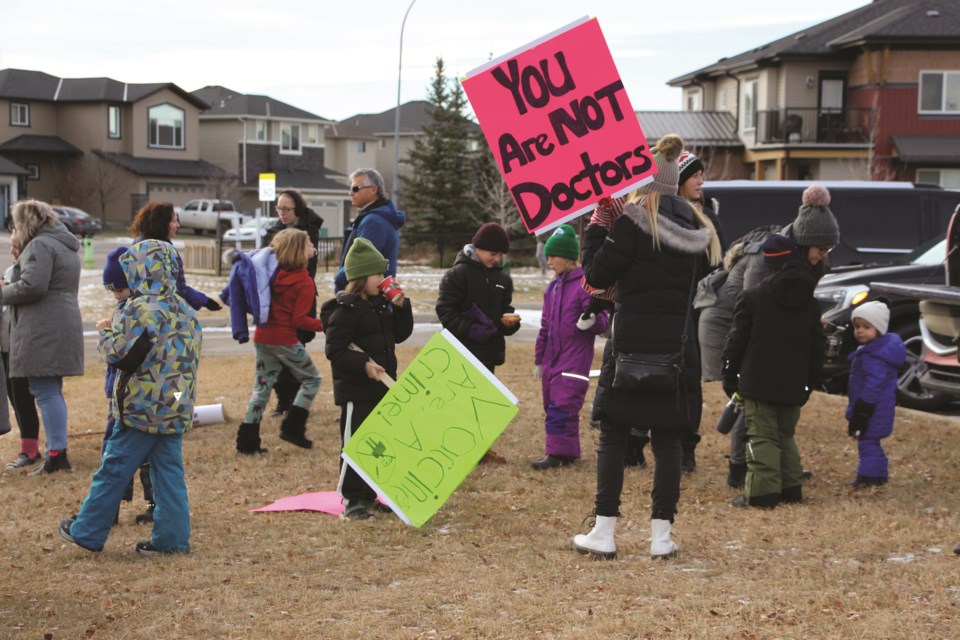 A group of parents and children gathered together outside the Rocky View Schools (RVS) Education Centre along Chinook Winds Drive to protest vaccine mandates on Nov. 25.