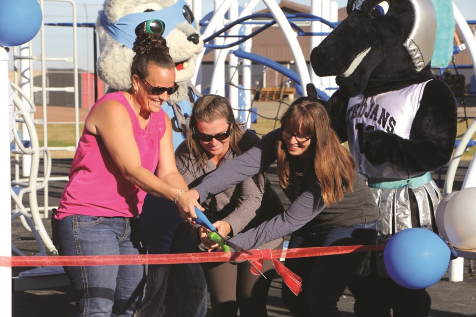 Members of a non-profit organization in support of W.G. Murdoch School called Friends of W.G. Murdoch cut the ribbon for the school's new playground on Oct. 13. 
