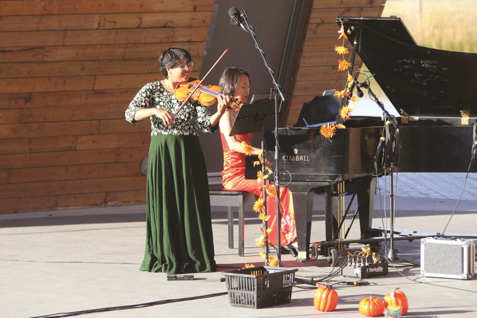Former Airdronian Tong Wang and long-time friend Maitreyi Muralidharan performed for an audience during the opening day of Windwood Festival at Nose Creek Regional Park on Oct. 4. 