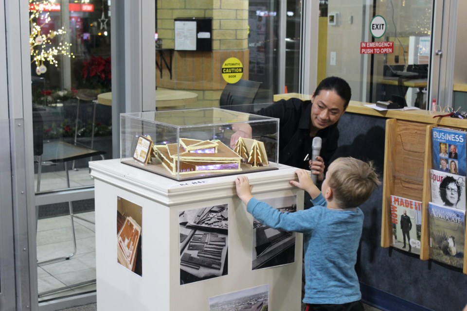 Artist KC BAE answers from questions for an excited little gingerbread fan at the APL on Thursday evening.