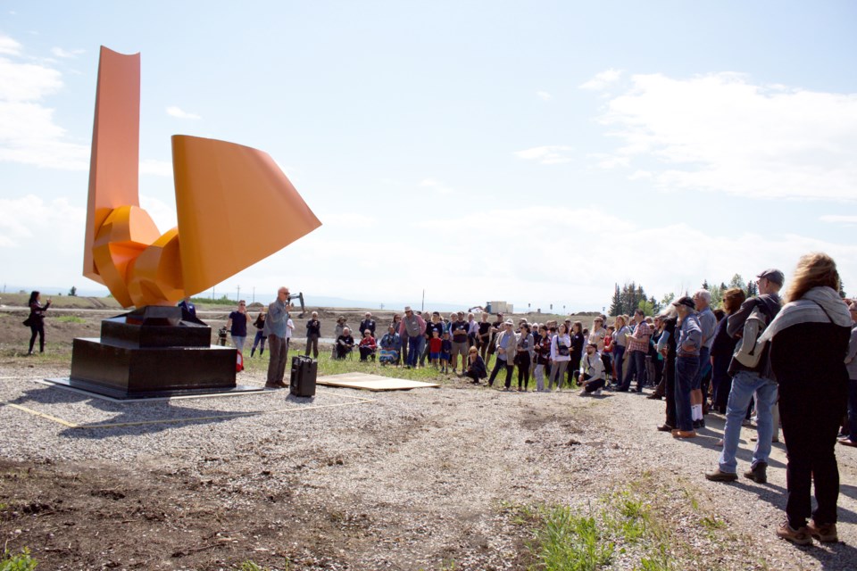 The KO Arts Centre in Springbank unveiled the latest addition to its sculpture park, Roy Leadbeater's "Steel Wave," during a ceremony June 22. Having stood outside the old CBC Calgary building since 1978, the sculpture was recently refurbished and donated to the Art Centre by the broadcasting company.
Photo by Ben Sherick/Rocky View Publishing