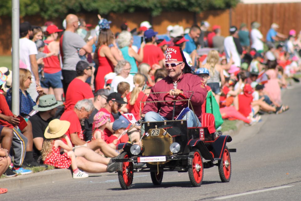 Thousands of red-clad residents and visitors lined Main Street on July 1 for the return of the Airdrie Canada Day Parade, which boasted floats, fun, and plenty of patriotism.