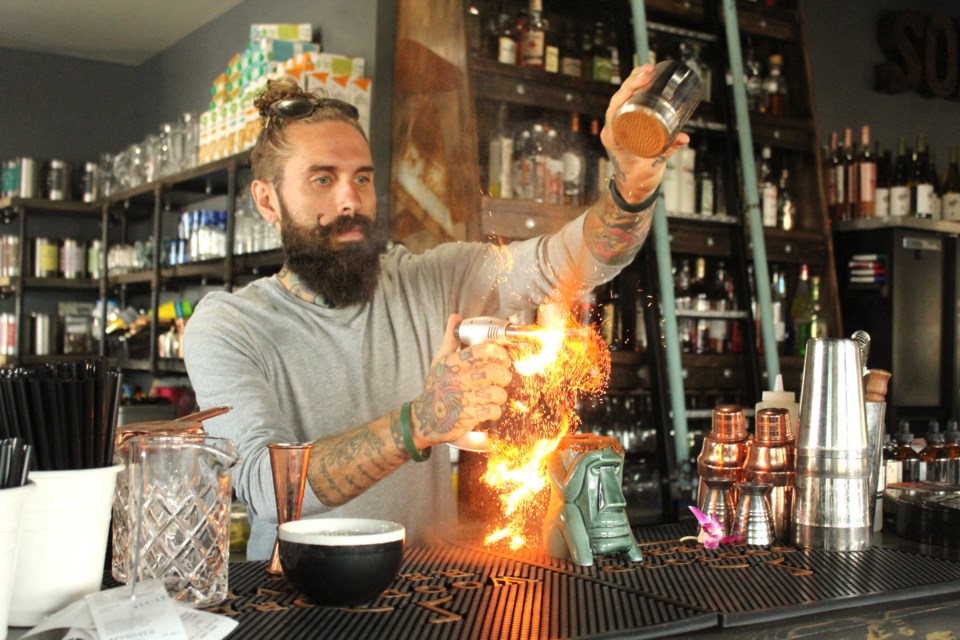 Sorso's London Richards puts the finishing touches on one of his signature Caesar cocktails, which is a finalist in a competition to be crowned the best Caesar in Canada.