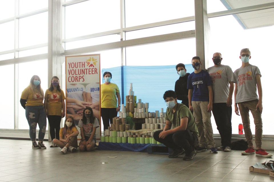 Members of the Airdrie Youth Volunteer Corps collected more than 800 canned food donations for the Airdrie Food Bank Sept. 25 and 26. Before donating the food, the group assembled the cans into a model of the Rocky Mountains. Photo by Scott Strasser/Airdrie City View.