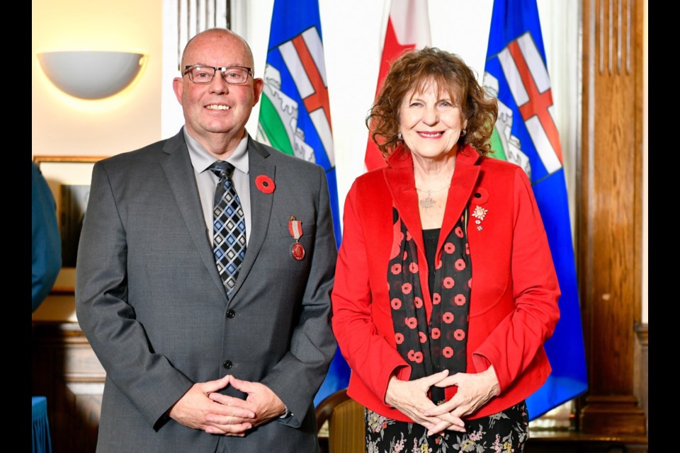 Paul Manuel (left) was honoured with the Sovereign's Medal for Volunteers Oct. 31 by the Lieutenant Governor of Alberta, Lois Mitchell. Photo Submitted/For Rocky View Publishing