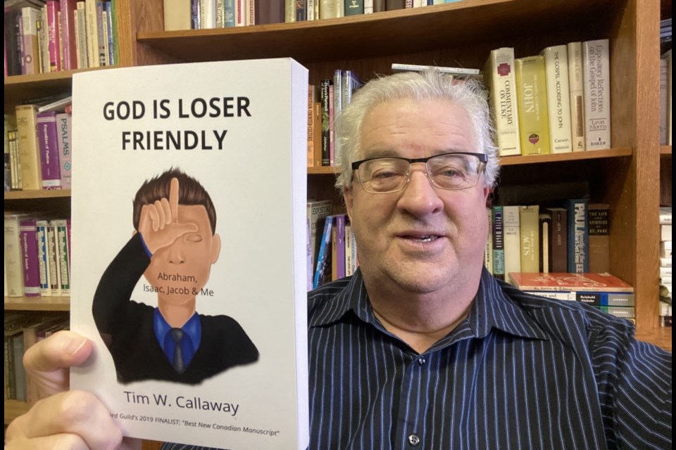 Tim Callaway, pastor of DayBreak Community Church in Airdrie, holds up his book, which was published Nov. 11. Photo submitted/For Airdrie City View.