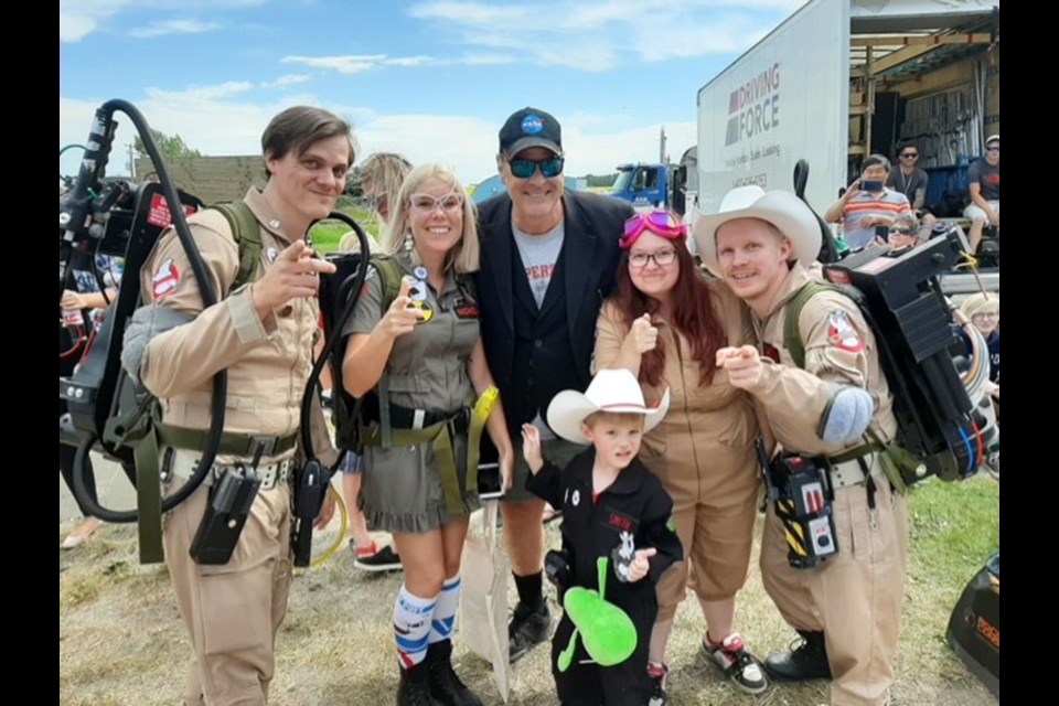 The Calgary Ghostbusters met a familiar face in Crossfield near the set of the new "Ghostbusters" 2020 film – original Ghostbusters actor Dan Aykroyd.  (Back row from left) Sean Nicholson, Candace Schneider, Aykroyd, Jessica Smith, Eldon Smith and Myrick Smith (Bottom). 
Photo Submitted/For Rocky View Publishing