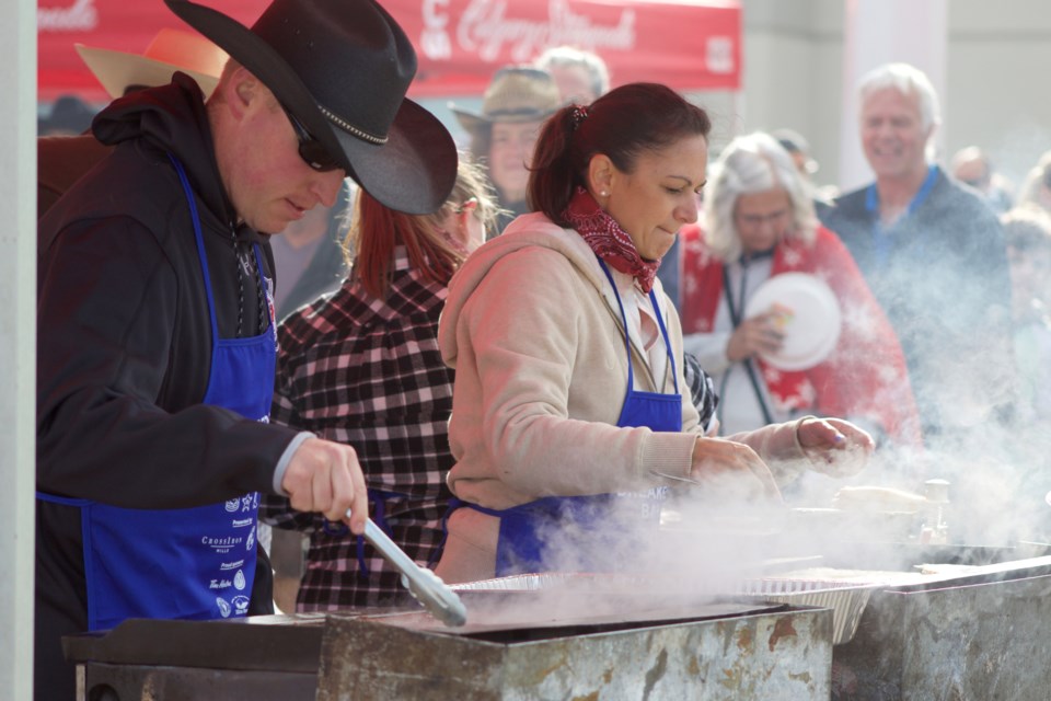 Crowds flooded to CrossIron Mills mall July 8 to get into the cowboy spirit at the annual Stampede Caravan Breakfast Bash. Attendees enjoyed free pancakes and sausage while taking in live entertainment and family activities.
Photo by Ben Sherick/Rocky View Publishing