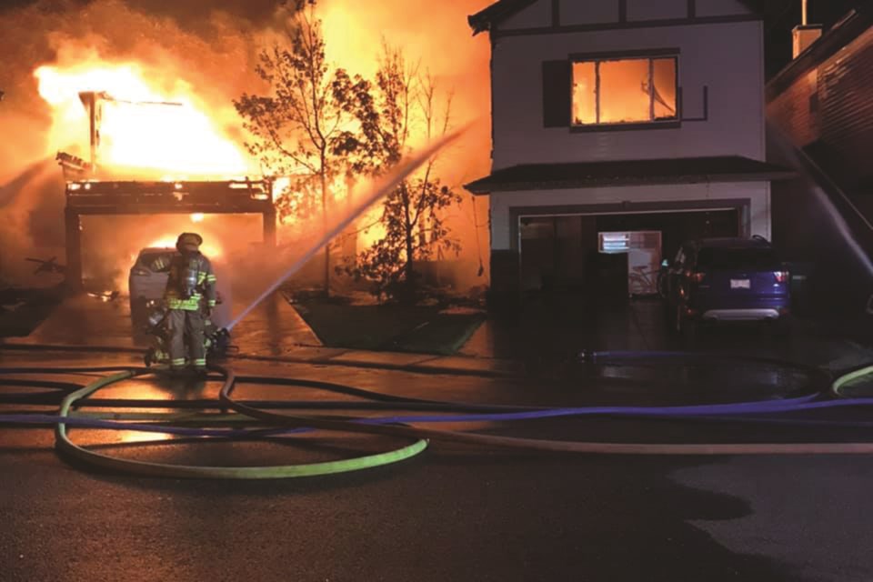 Airdrie firefighters battled a blaze that engulfed two homes Aug. 7. Photo Submitted/For Airdrie City View