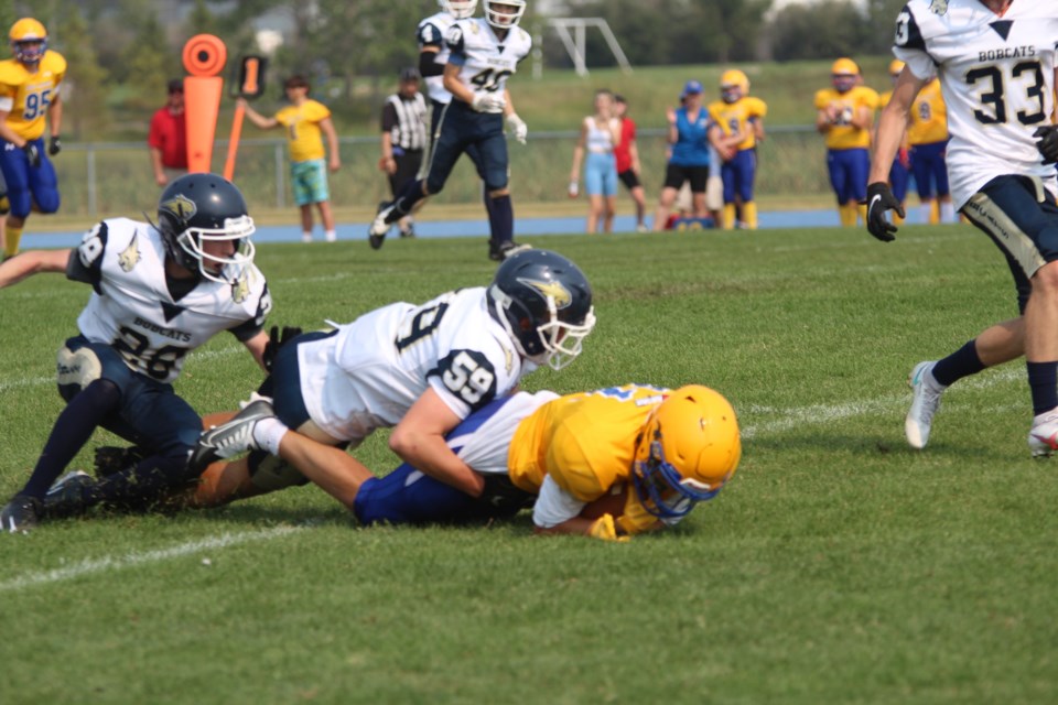 The Bert Church Chargers ground through a punishing Bow Valley's Bobcats defense in the first half to gain momentum in the second half, leading to a 23-7 victory for the Chargers over the visiting team.