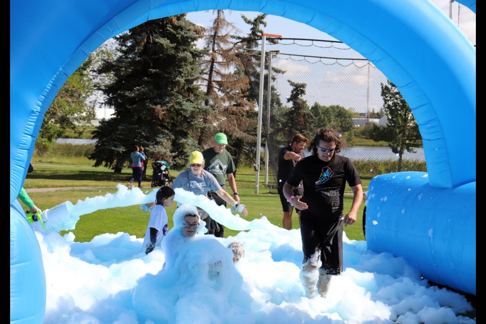 Families delighted in bubbly excitement at the Big Brothers and Sisters Bubble Chase Event on Aug. 19. The 5K fun run started at the field behind Bert Church High School.