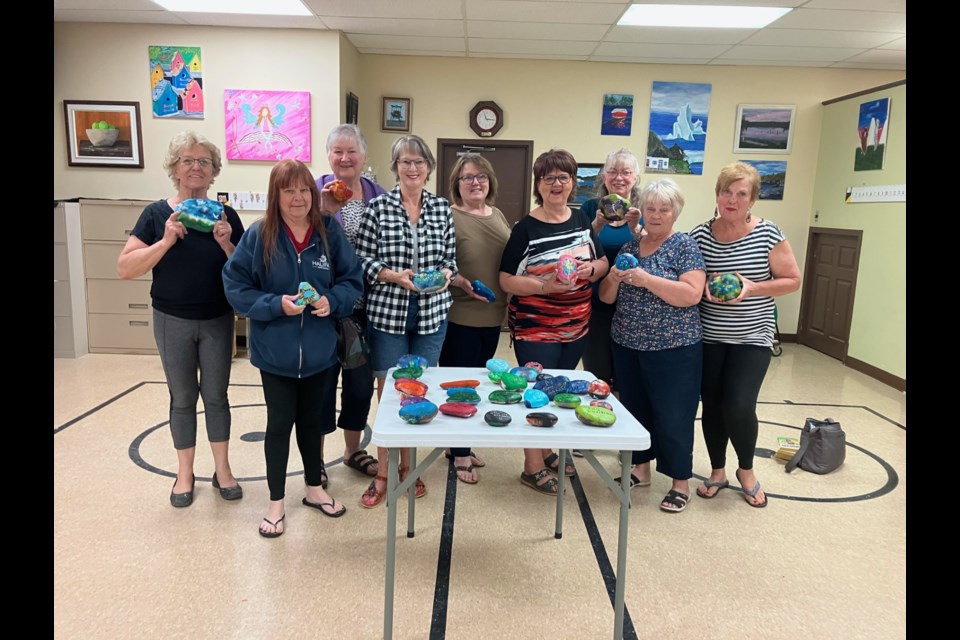 The Airdrie Over 50 Club recently hosted art classes, after which they painted dozens of rocks to hide throughout the community.