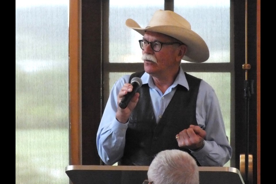 Cowboy poet Bob Janzen receites his work at the Stockmen's Memorial Foundation's Pie and Poetry event on June 8, in celebration of Seniors Week in Cochrane.