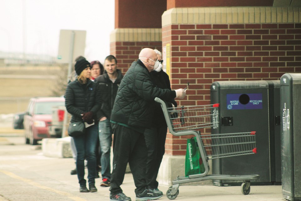 Grocery stores in Airdrie are taking steps to help limit the potential spread of COVID-19, such as setting up signage urging shoppers to change their behaviours help prevent the virus' spread. Photo: Scott Strasser/Airdrie City View 