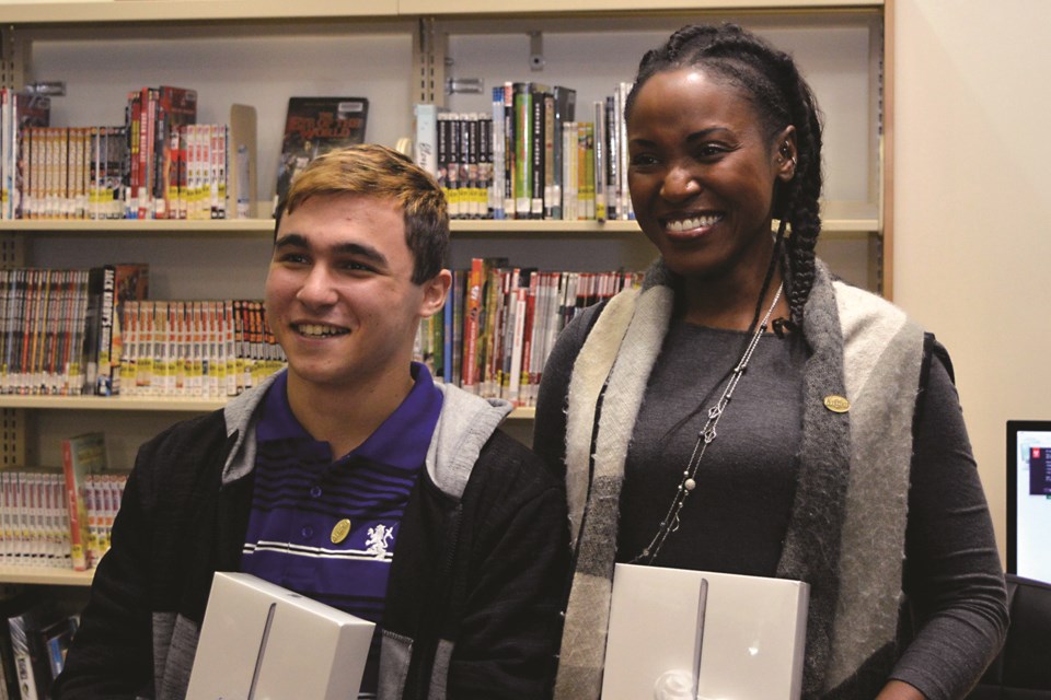 (From left) Radwan Matar and Sholley Poweel won Airdrie Public Library's 2019 Poetry in Motion Contest in the Youth and Open categories, respectively. APL's Second Annual Poetry Contest runs until June 30. Photo Submitted/For Airdrie City View