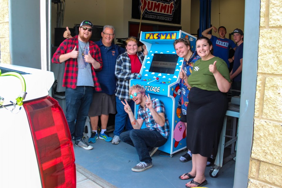 W.H. Croxford mechatronics students helped repair and improve the old pac-man machine at BGC Airdrie's headquarters.