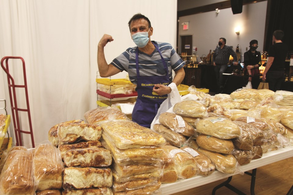 Jose Gonzalez Sorto, owner of Bun Queen Bakery & Deli in Calgary, has been preparing mountains of fresh loaves for the Airdrie Farmers Market. Photo by Carmen Cundy/Airdrie City View