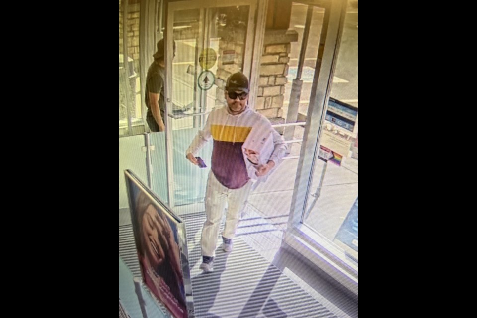 Cochrane RCMP are trying to figure out who this man is, after he allegedly spat at an employee of a local business when trying to return an item.