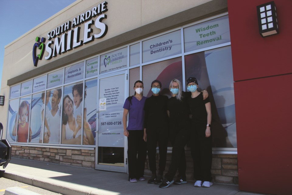 Dr. Amrita Sandhu (second from left) says recent research has proven proper oral health-care can help prevent serious outcomes associated with COVID-19.