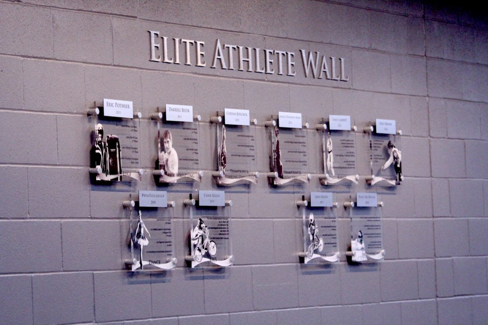 The winners of the City of Airdrie's Elite Athletes Awards are highlighted on the wall of Genesis Place Recreation Centre.