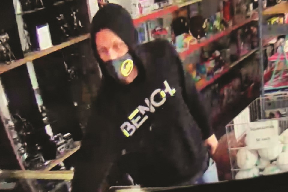 Airdrie RCMP is trying to identify this individual, allegedly the suspect in a March 4 break-in at a business along Kingsview Boulevard. Photo submitted/For Airdrie City View.
