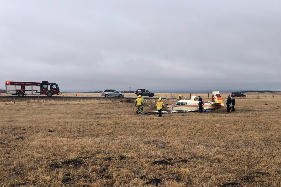 One person is dead and another has been left in life-threatening condition following a plane crash off Highway 1, near the Springbank Airport April 22. (Howard May/The Cochrane Eagle)