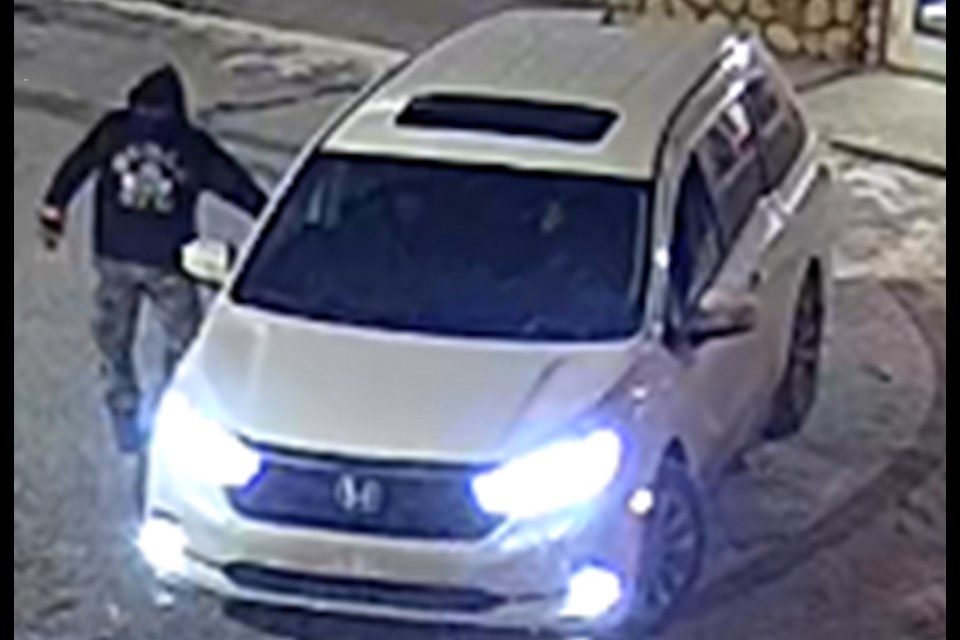 The suspect was described as standing between 5'10" and 6'0 tall, with a black hoodie that had a white design on the front and back.